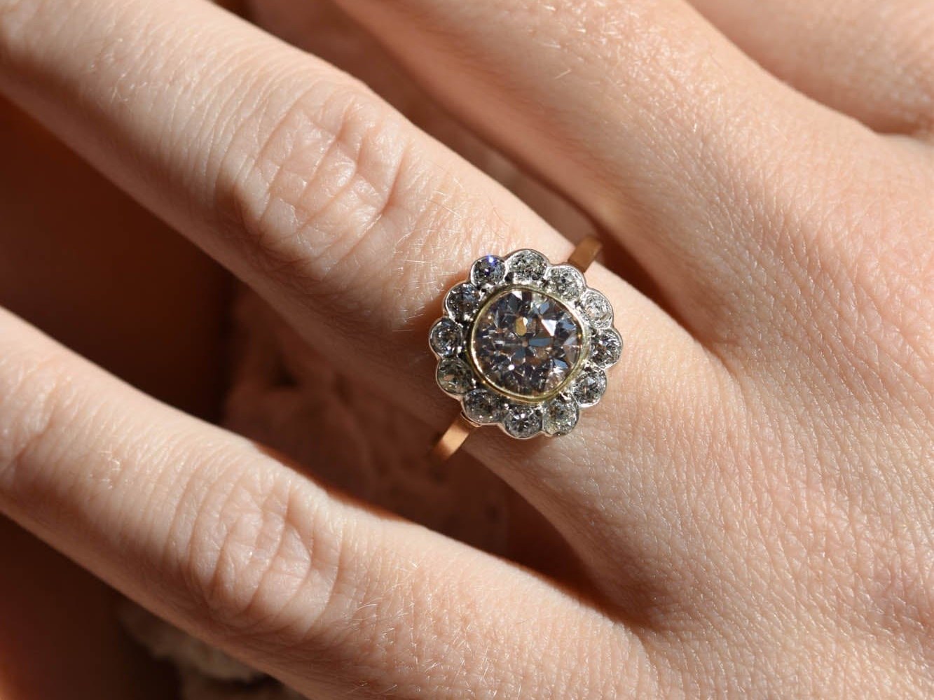 A Victorian old mine cut brown diamond ring worn on hand — the combination of warm stone and antique cut is exactly the aesthetic that went mainstream post-Swift