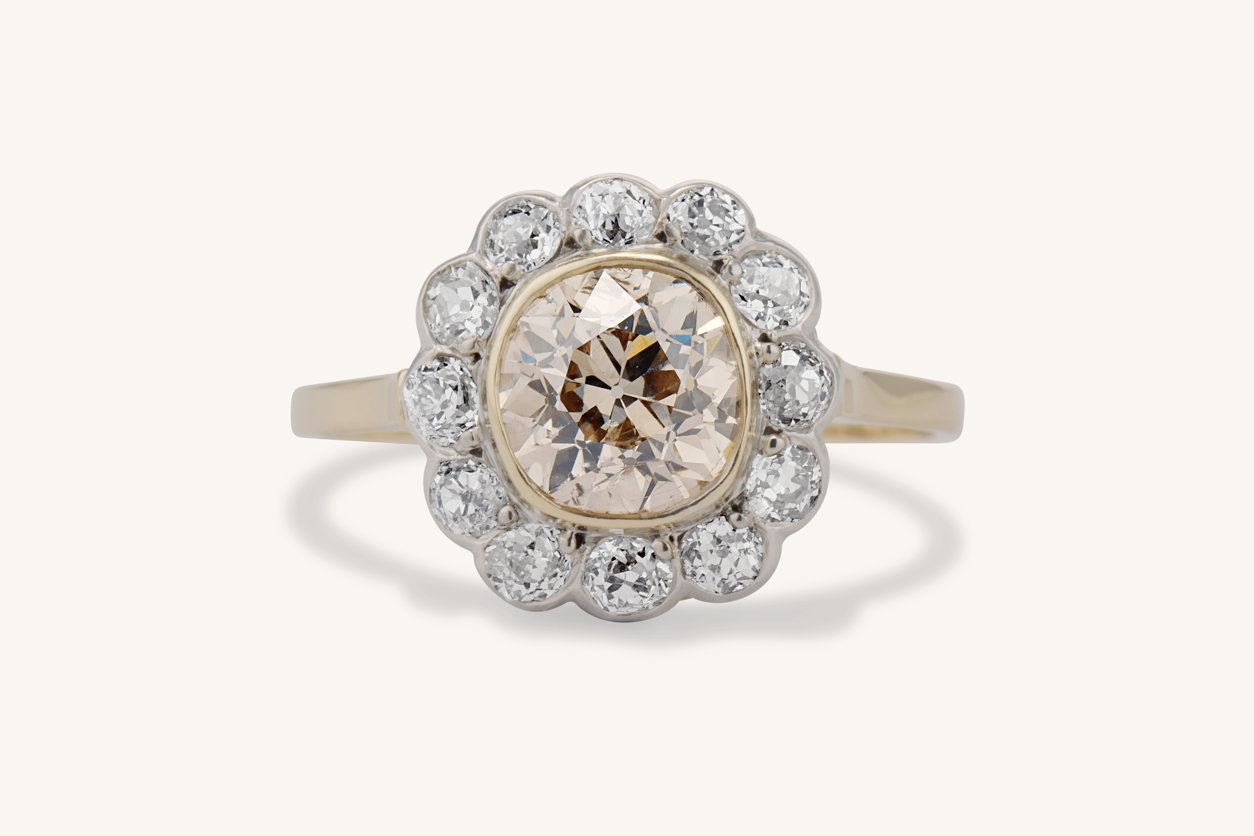 A Victorian old mine cut brown diamond cluster ring at Erstwhile — the warm center reads unmistakably against the white diamond halo, a reminder that setting and context shape how a brown stone looks