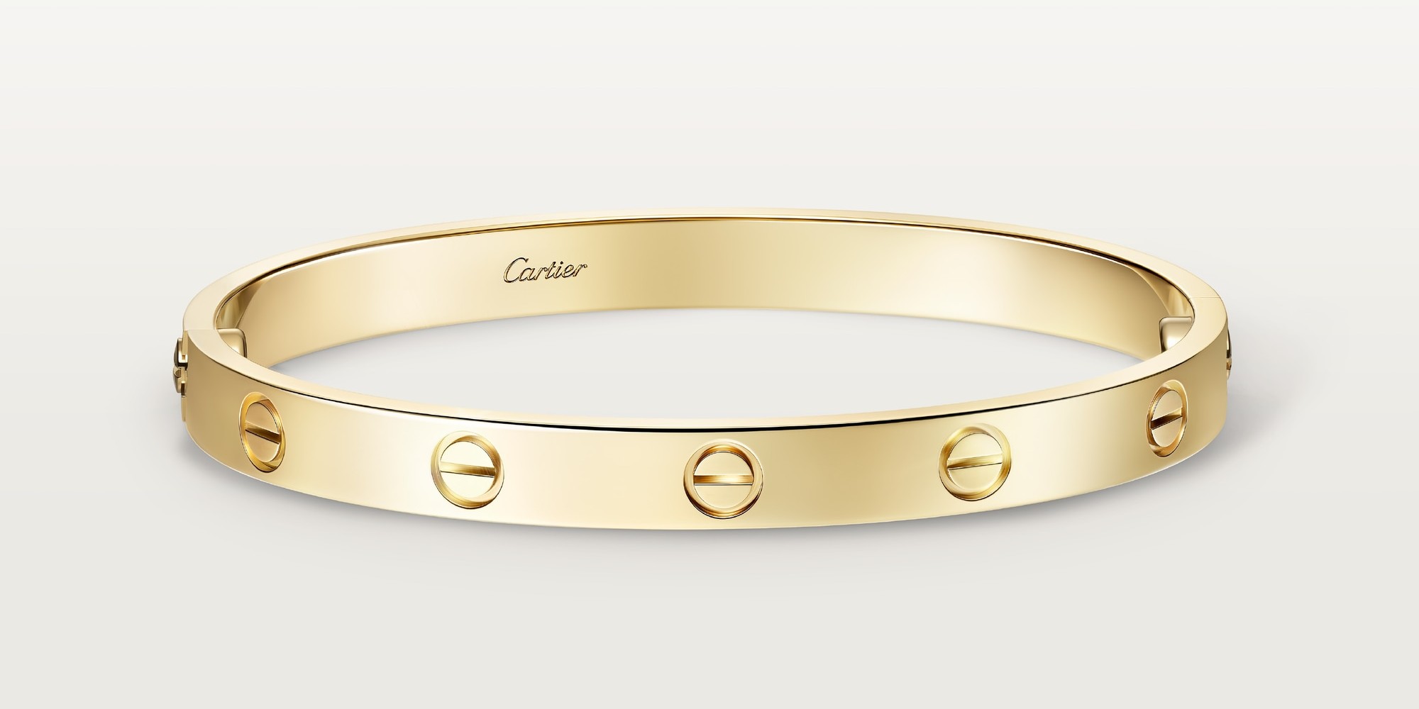 Love bracelet in classic yellow gold by Cartier. Image courtesy of Cartier.