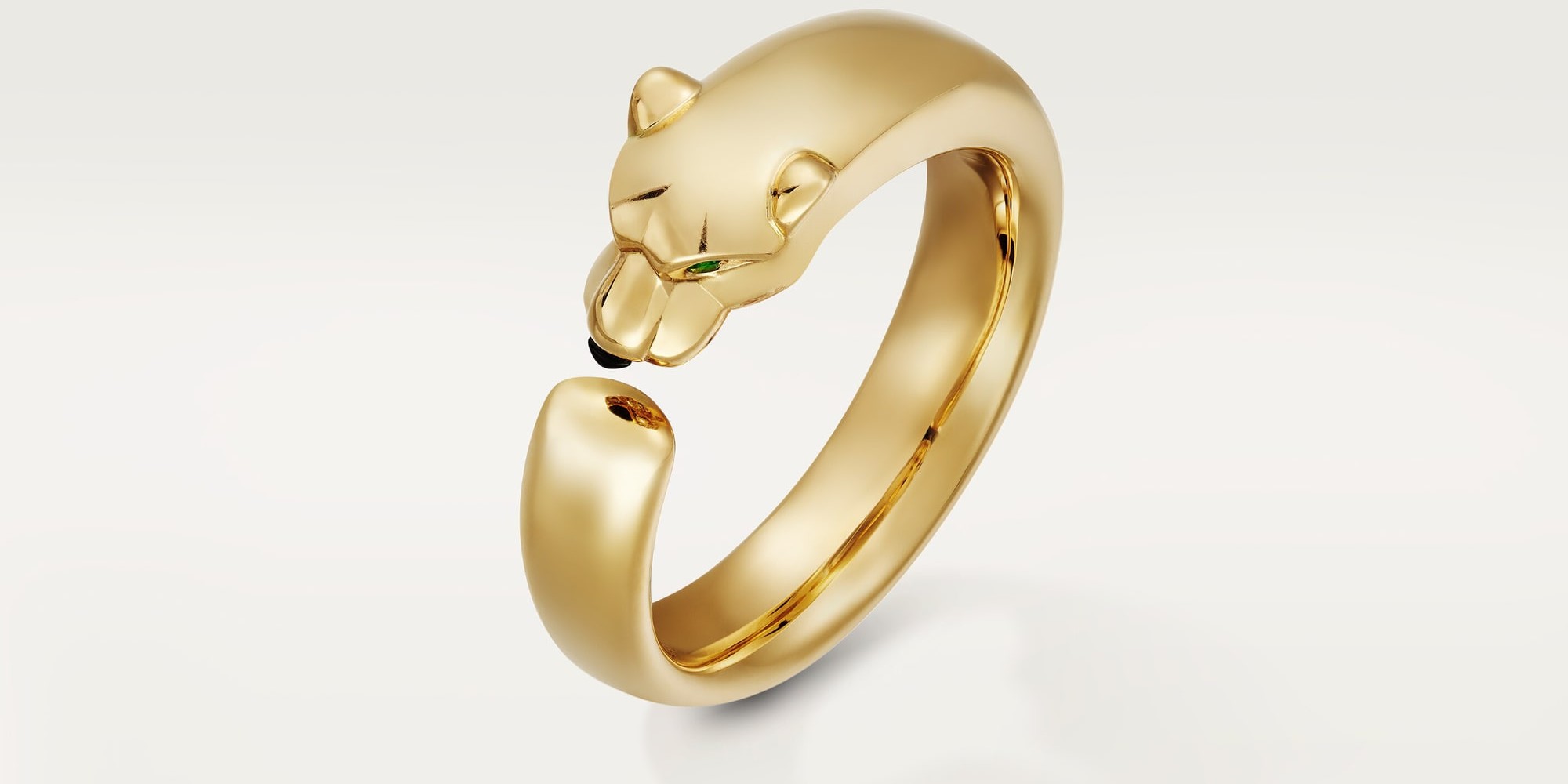 Panthère de Cartier ring, small model, yellow gold with tsavorite and onyx. Image courtesy of Cartier.