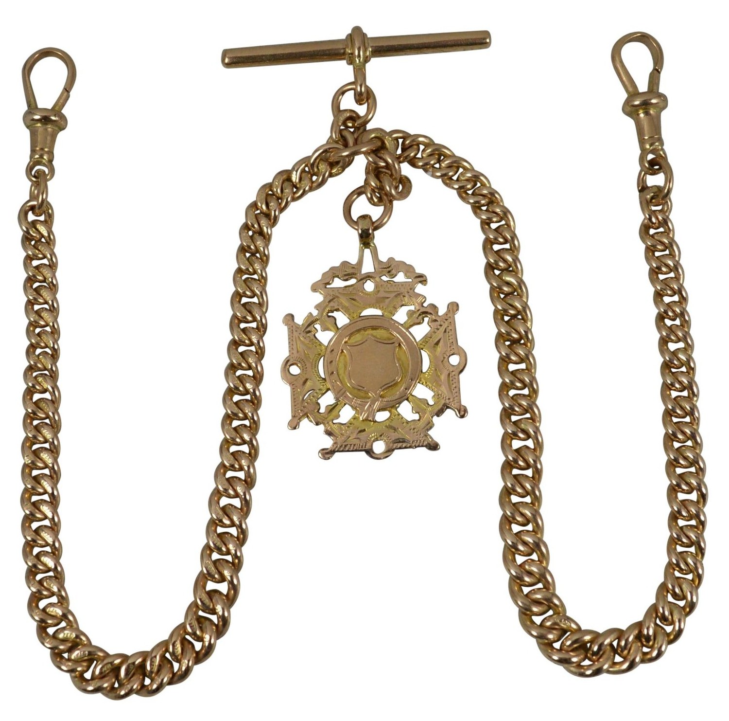 A late-Victorian rose gold double albert watch chain, T-bar at the top and an engraved shield fob hanging at the centre - when men's ornament thinned out, what survived was jewelry with a job, and this one held a watch.