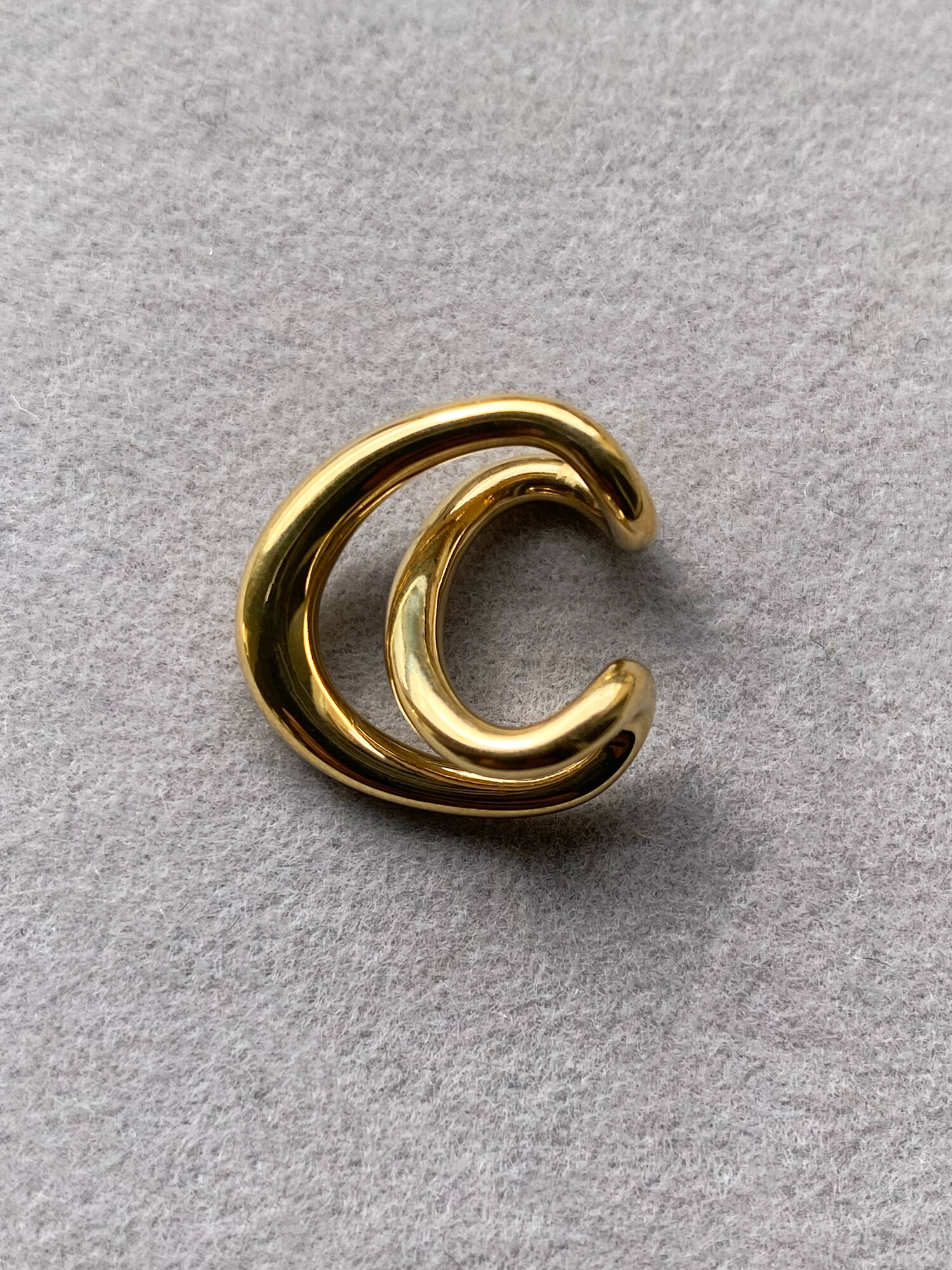 Charlotte Chesnais Initial Cuff on a bare ear. Image courtesy of Charlotte Chesnais.