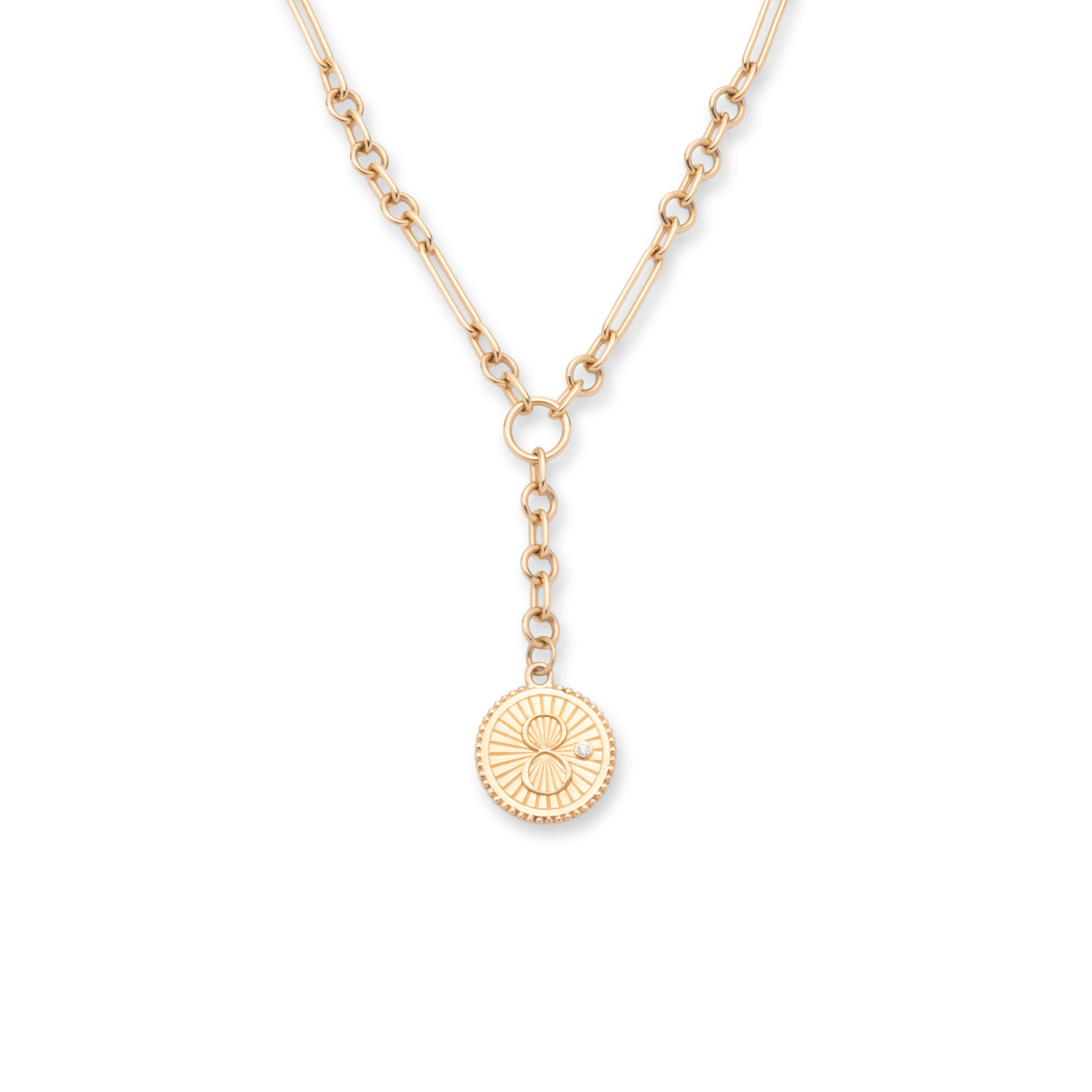 A Foundrae karma medallion on the house's signature belcher chain in 18k yellow gold.